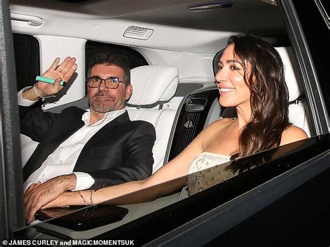simon cowell and his glamorous fiancée lauren silverman hold hands as