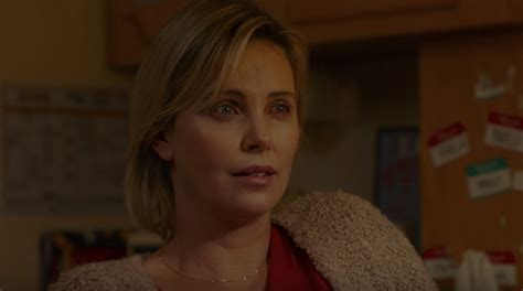 charlize theron embraces motherhood in new trailer for