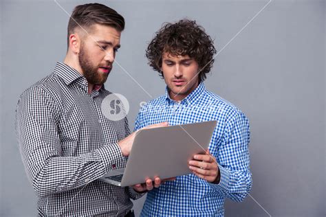 Two Handsome Men Using Laptop Royalty Free Stock Image Storyblocks