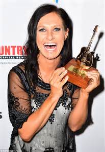 queen of country music kasey chambers beams with pride as she walks the