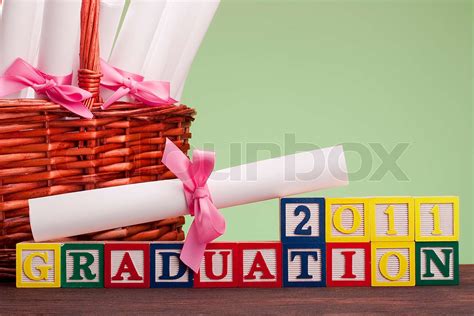diploma tied   ribbon  text   wooden blocks graduation  stock image