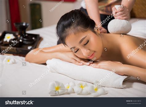 woman having massage and spa salon she is very happy