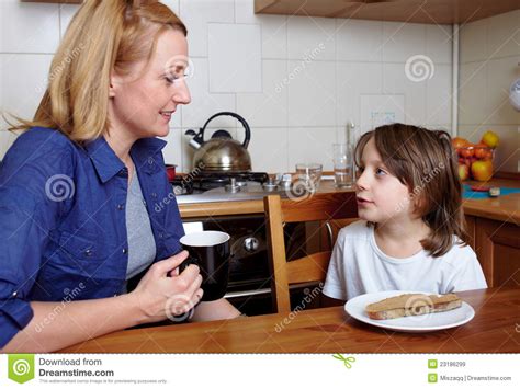 Mother And Son Sits In Kitchen During Dinner Royalty Free