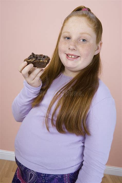 teenage girl holding pastry stock photo image   ethnicity