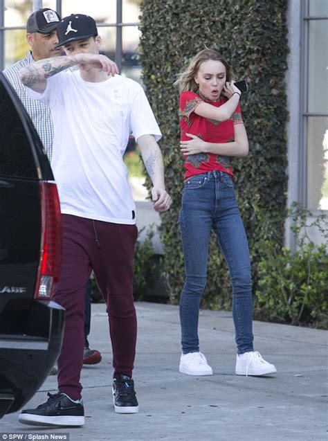 lily rose depp in skinny jeans and printed t shirt on