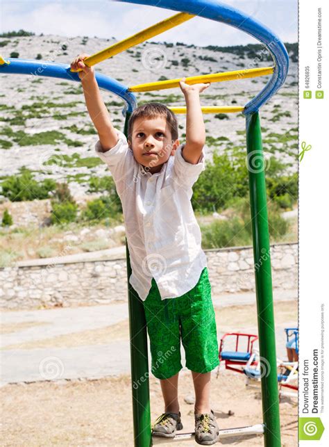 boy playing  jungle gym stock image image  park
