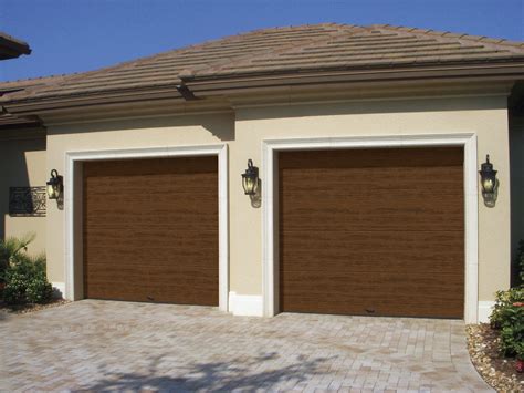 clopay introduces cypress collection insulated flush steel garage doors  ultra grain paint