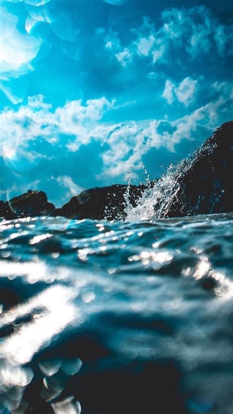 aesthetic iphone wallpaper ocean waves rocks blue sky