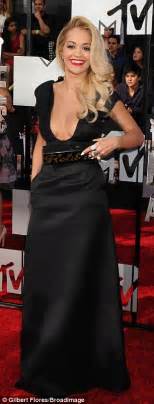 rita ora shows off her ample cleavage in plunging black gown at mtv