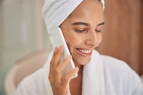 Premium Photo Cheerful Young Woman Talking On Mobile Phone After Shower