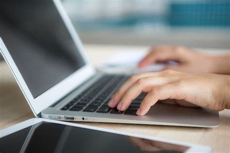 person writing   laptop photo