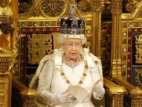 queens speech   monarch   wearing  crown  regal attire  parliament today