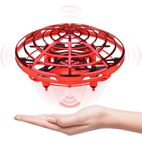 hand operated drones  kids hands  mini drone helicopter flying sun baby
