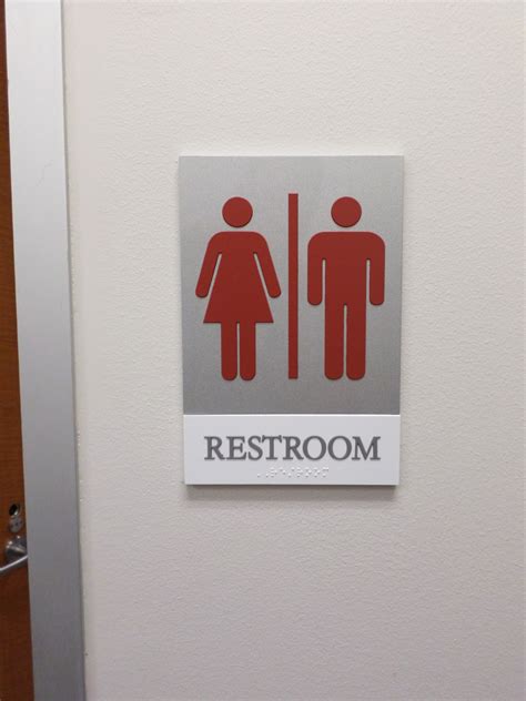 unisex restroom  sign austin tx hightech signs
