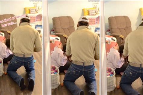 dad steps in to blow dry daughter s hair when she gets too tired to