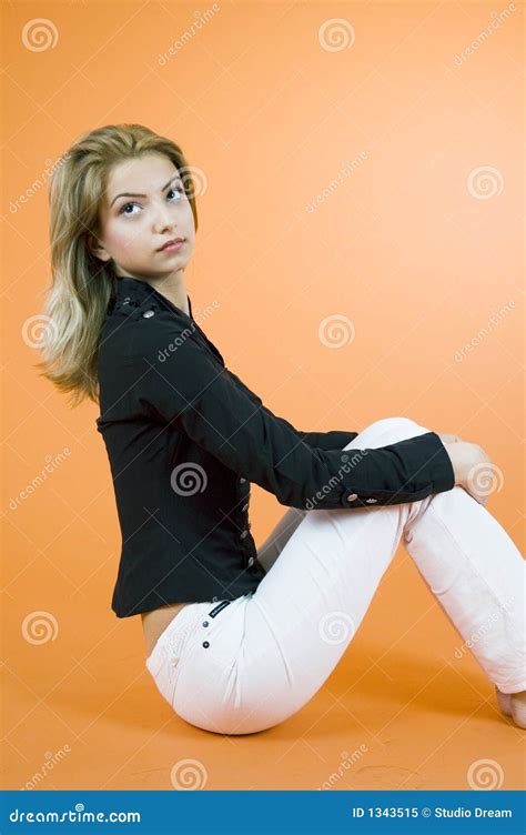 woman sitting  glancing  royalty  stock photo image