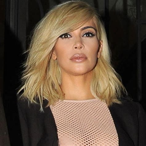 newly blond kim flashes nipples and flaunts pda with kanye at pfw e online