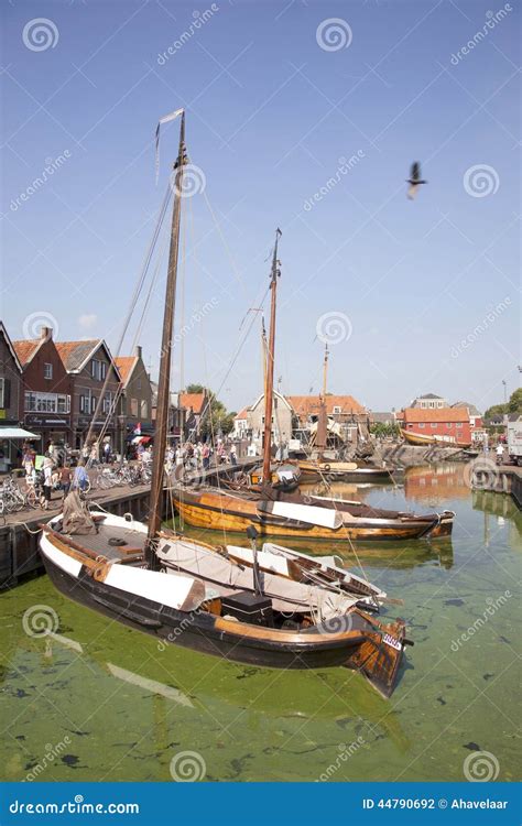 dutch sailing vessels   harbor  spakenburg editorial photography image  water
