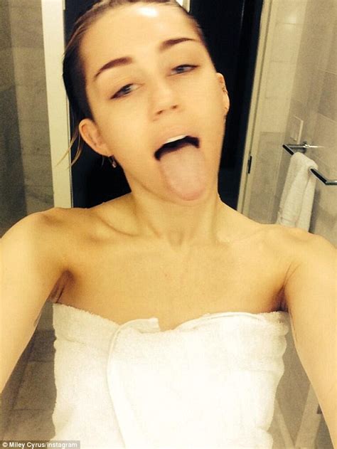 miley cyrus poses with no make up and damp hair in another shower selfie daily mail online