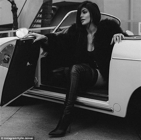 kylie jenner poses in a corset of white feathers in photoshoot daily mail online