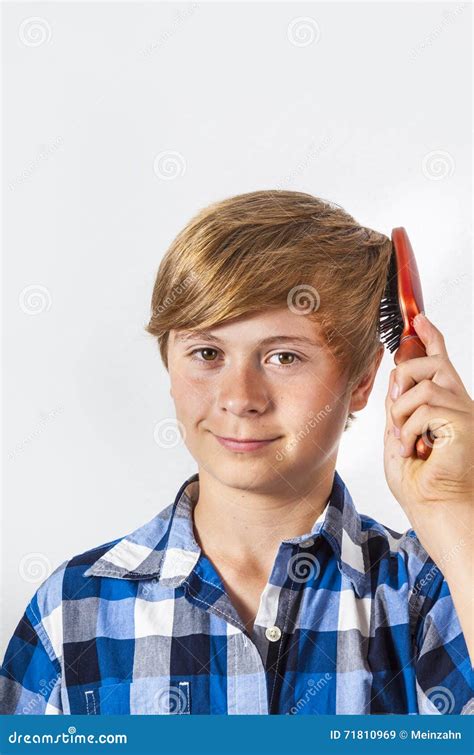 young boy brushing  hair stock image image  haircare positive