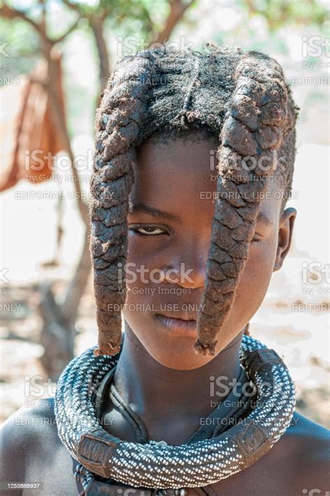 Himba Girl With Traditional Hair Locks Posing For Photographers Stock