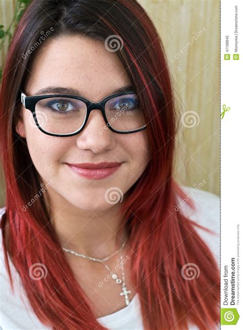 beautiful girl with red hair and glasses with black frame stock image