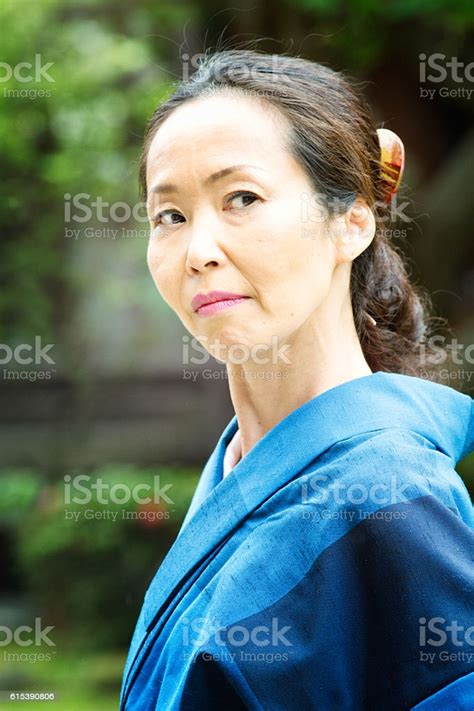 Suspicious Critical Mature Japanese Woman Looking Back