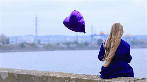 sad girl  broken heart holding heart balloon stock video footage storyblocks