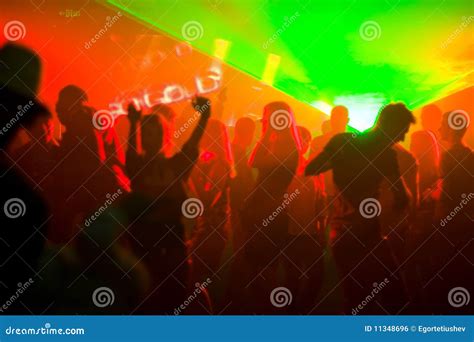 dancing people  red disco light stock photo image  event entertainment
