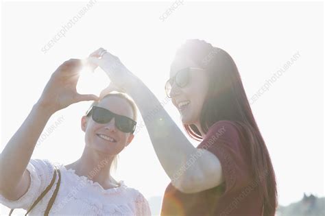 Lesbian Couple Forming Heart Shape With Hands Stock Image F023 0086