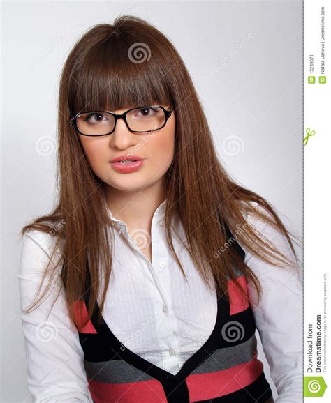 portrait of pretty brunette girl in glasses speacs stock
