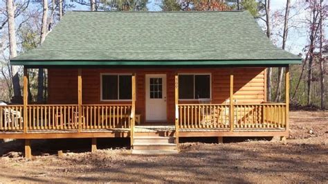 man builds small cabin  virginia acreage