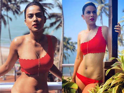 [unseen] Nia Sharma Flaunts Her Sexy Curves In Red Bikini Hd Photos
