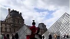 A Chinese female martial artist shows off her impressive Kung Fu skills outside the Louvre Museum in Paris