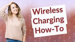 How do I enable wireless charging on my iPhone 11?