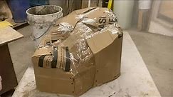 Make fake rock using cardboard covered with cement