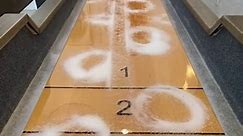 Shuffleboard sand changes how puck moves
