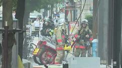 Fire fighters and rescuers at blast site in Tokyo | AFP