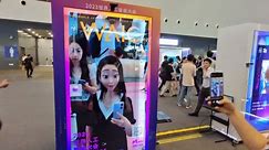 Visitors Experience Interactive Face Changing at 2023 WAIC in Shanghai, China