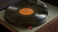 Vinyl record rotating on a turntable in slow motion
