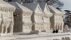 See houses frozen over by massive winter storm