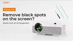 How to fix black spots on projector screen?