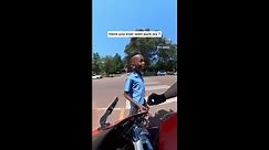 Schoolboy can't contain excitement after biker lets him rev motorcycle engine