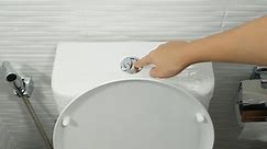 4K of finger pushing button and flushing toilet