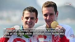 Triathlete helps his brother across the finish line
