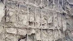 process of working on a concrete wall