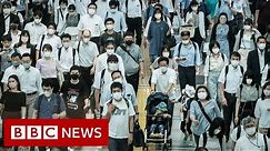 Japan widens emergency over 'frightening' Covid spike - BBC News