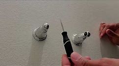 Removing a toilet paper holder that doesn't have set screws.