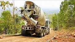 Hino 500 Ready Mix Cement Truck Delivering Pouring Concrete On Hill Road Construction